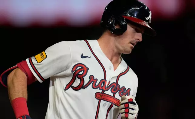 Atlanta Braves' Mike Yastrzemski (18) runs the bases after hitting his solo home run against the New York Mets in the seventh inning of a baseball game, Wednesday, Aug. 12, 2026, in Atlanta. (AP Photo/Mike Stewart)