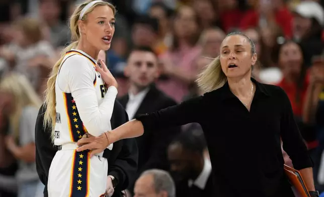 Indiana Fever's Sophie Cunningham reacts while talking to the Chicago Sky bench after being fouled during the first half of an WNBA basketball game in Chicago, Saturday, Aug. 8, 2026. (AP Photo/Paul Beaty)