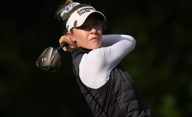 Nelly Korda, of the United States, watches her tee shot on the 14th hole during the first round at the LPGA Canadian Women's Open golf tournament in Edmonton, Alberta, Thursday, Aug. 20, 2026. (Darryl Dyck/The Canadian Press via AP)