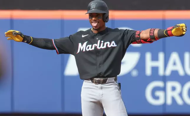 Miami Marlins' Esteury Ruiz reacts after reaching second base on a New York Mets error during the second inning of a baseball game, Saturday, Aug. 1, 2026, in New York. (AP Photo/Heather Khalifa)