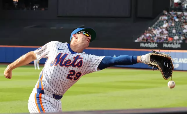 New York Mets first baseman Jared Young drops a foul ball during the sixth inning of a baseball game against the Miami Marlins, Saturday, Aug. 1, 2026, in New York. (AP Photo/Heather Khalifa)