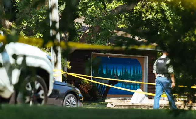 Law enforcement respond to a call at a home daycare, Wednesday, Aug. 12, 2026, in Hopkins, Minn. (AP Photo/Carly Danek)