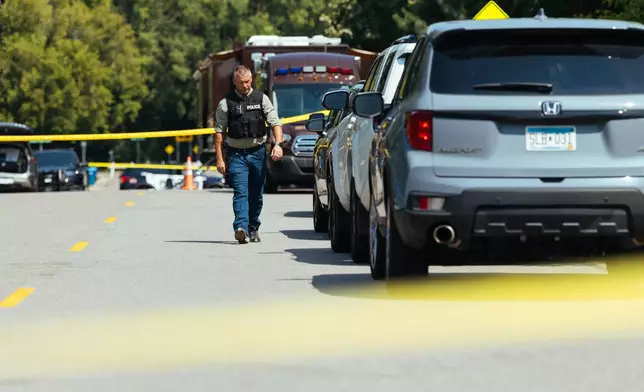Law enforcement respond to a call at a home daycare, Wednesday, Aug. 12, 2026, in Hopkins, Minn. (AP Photo/Carly Danek)