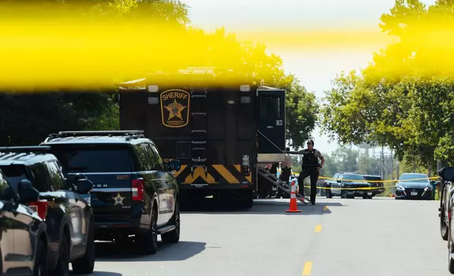 Law enforcement respond to a call at a home daycare, Wednesday, Aug. 12, 2026, in Hopkins, Minn. (AP Photo/Carly Danek)