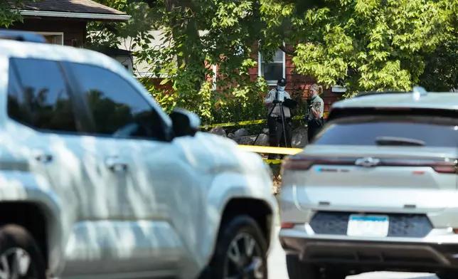 Law enforcement respond to a call at a home daycare, Wednesday, Aug. 12, 2026, in Hopkins, Minn. (AP Photo/Carly Danek)