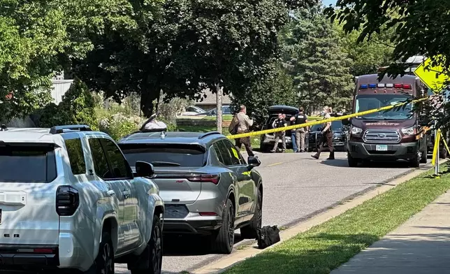 Law enforcement respond to a call at a home daycare, Wednesday, Aug. 12, 2026, in Hopkins, Minn. (AP Photo/Mark Vancleave)