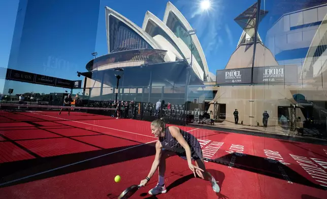 Spanish player Alejandra Salazar hits the ball on a padel court installed at the Sydney Opera House for an invitational tournament in Sydney, Friday, Aug. 14, 2026. (AP Photo/Rick Rycroft)