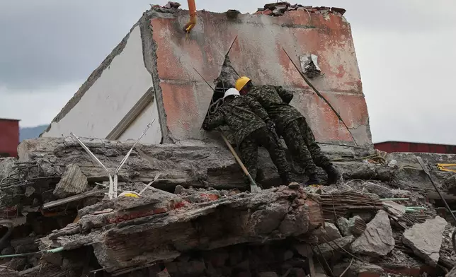 Rescuers assess earthquake damage in Cali, Colombia, Sunday, Aug. 16, 2026. (AP Photo/Santiago Saldarriaga)