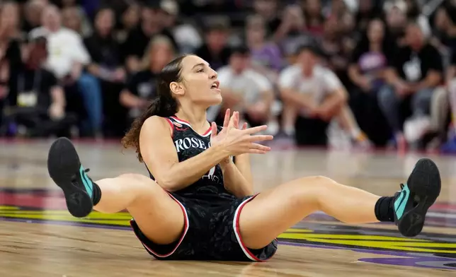 Portland Fire guard Carla Leite celebrates a score and being fouled against the Phoenix Mercury during the first half of a WNBA basketball game Sunday, Aug. 16, 2026, in Phoenix. (AP Photo/Ross D. Franklin)