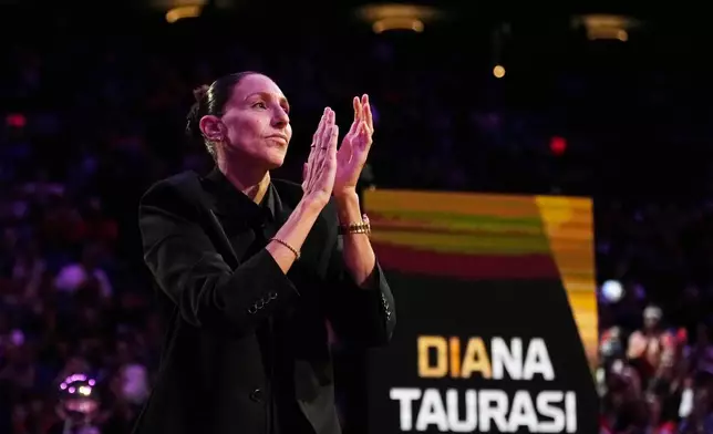 Retired WNBA Phoenix Mercury basketball player Diana Taurasi is honored during a halftime Ring of Honor ceremony Sunday, Aug. 16, 2026, in Phoenix. (AP Photo/Ross D. Franklin)