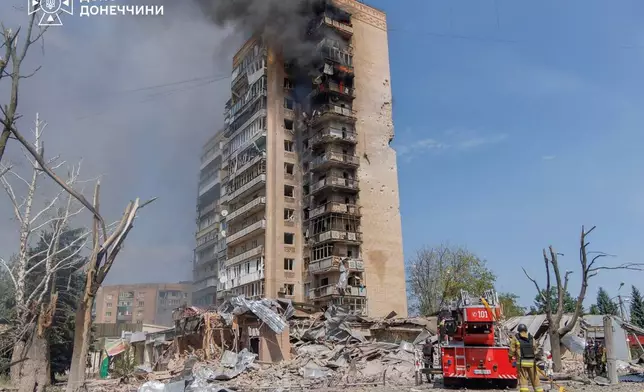 In this photo provided by the Ukrainian Emergency Service, firefighters put out a fire in a residential building following a Russian air attack in Kramatorsk, Donetsk region, Ukraine, Wednesday, Aug. 5, 2026. (Ukrainian Emergency Service via AP)