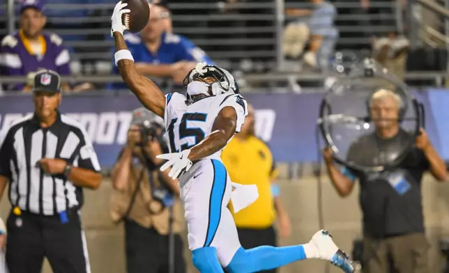 Carolina Panthers wide receiver Jimmy Horn Jr. (15) reaches for but can't hold onto a pass in the first half of the Pro Football Hall of Fame NFL preseason game against the Arizona Cardinals in Canton, Ohio, Thursday, Aug. 6, 2026. (AP Photo/David Richard)