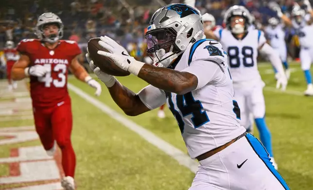 Carolina Panthers running back Anthony Tyus III runs to the end zone in front of Arizona Cardinals linebacker Karson Sharar (43) after a catch in the second half of the Pro Football Hall of Fame NFL preseason game in Canton, Ohio, Thursday, Aug. 6, 2026. (AP Photo/David Richard)