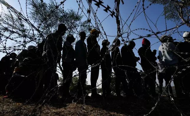FILE - Malawian migrants stand in a queue for their deportation at a temporary centre, in Durban, South Africa, on June 18, 2026. (AP Photo/Themba Hadebe, file)