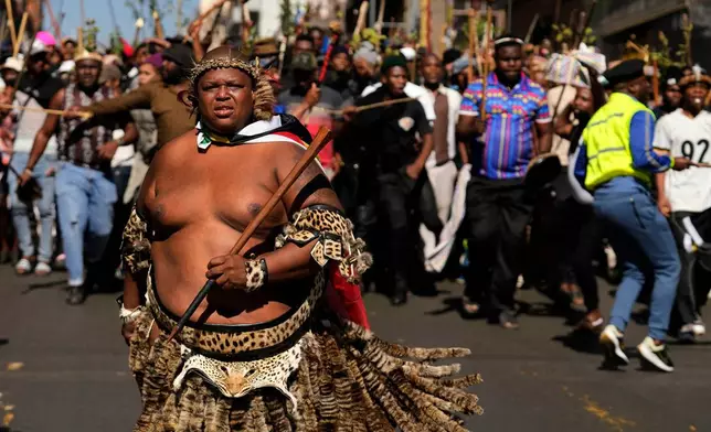 FILE - A protester dressed traditional attire marches against illegal immigration, in Johannesburg, South Africa, June 30, 2026. (AP Photo/Themba Hadebe, File)