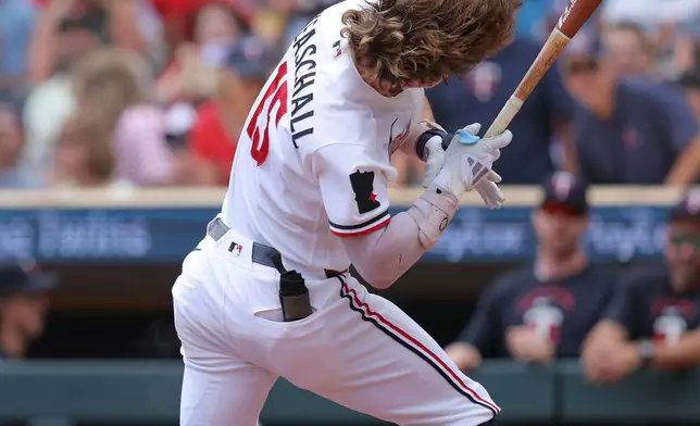 Minnesota Twins' Luke Keaschall is hit on the head by a pitch during the first inning of a baseball game against the Philadelphia Phillies, Sunday, Aug. 16, 2026, in Minneapolis. (AP Photo/Bailey Hillesheim)