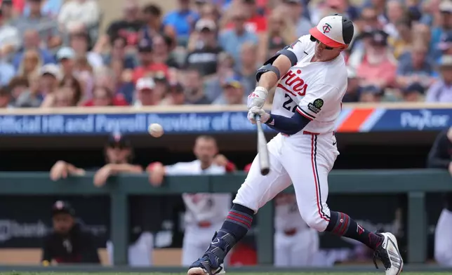 Minnesota Twins' Brooks Lee hits a grand slam during the first inning of a baseball game against the Philadelphia Phillies, Sunday, Aug. 16, 2026, in Minneapolis. (AP Photo/Bailey Hillesheim)