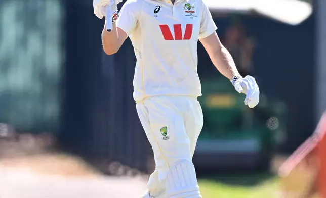 Cameron Green of Australia gestures after reaching 50 runs during play on day four of the first cricket test against Bangladesh in Darwin, Australia, Sunday, Aug. 16, 2026. (James Ross/AAP Image via AP)
