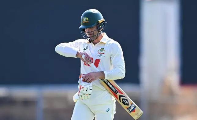 Alex Carey of Australia walks from the field after being dismissed during play on day four of the first cricket test against Bangladesh in Darwin, Australia, Sunday, Aug. 16, 2026. (James Ross/AAP Image via AP)