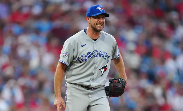 Toronto Blue Jays pitcher Max Scherzer reacts after a strike out against Philadelphia Phillies' Bryan de la Cruz during the fifth inning of a baseball game, Saturday, Aug. 8, 2026, in Philadelphia. (AP Photo/Derik Hamilton)