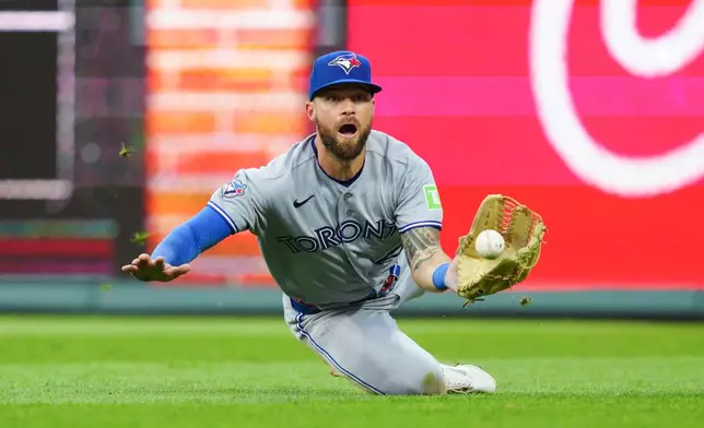 Toronto Blue Jays' Nathan Lukes makes a catch on a ball hit by Philadelphia Phillies' Garrett Stubbs during the fifth inning of a baseball game, Saturday, Aug. 8, 2026, in Philadelphia. (AP Photo/Derik Hamilton)