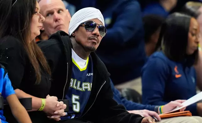 Actor Nick Cannon attends during a WNBA basketball game between the Connecticut Sun and Dallas Wings in Arlington, Texas, Sunday, Aug. 2, 2026. (AP Photo/Tony Gutierrez)
