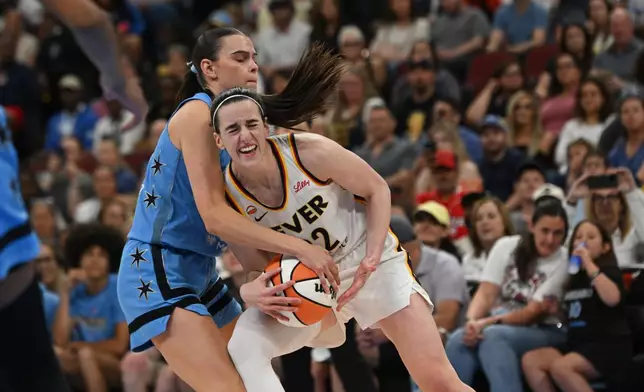 Indiana Fever's Caitlin Clark, right, battles Chicago Sky's Gabriela Jaquez, left, for control of the ball during the second half of a WNBA basketball game in Chicago, Saturday, Aug. 8, 2026. (AP Photo/Paul Beaty)