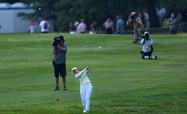 Miyu Yamashita, of Japan, hits her second shot on the ninth hole during the final round at the LPGA Canadian Women's Open golf tournament in Edmonton, Alberta, Sunday, Aug. 23, 2026. (Darryl Dyck/The Canadian Press via AP)