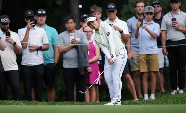 Miyu Yamashita, of Japan, chips onto the 14th green with her third shot during the final round at the LPGA Canadian Women's Open golf tournament in Edmonton, Alberta, Sunday, Aug. 23, 2026. (Darryl Dyck/The Canadian Press via AP)