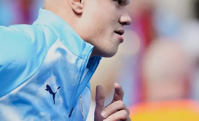 Manchester City's Erling Haaland warms up prior to the English Premier League soccer match between Manchester City and Bournemouth in Manchester, England, Sunday, Aug. 23, 2026. (AP Photo/Dave Thompson)