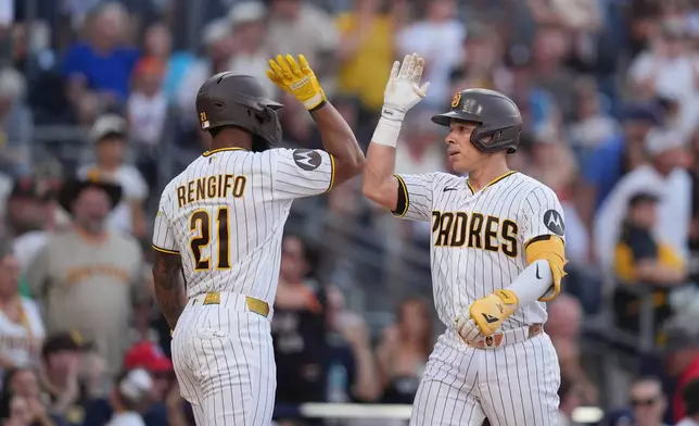 San Diego Padres' Freddy Fermin, right, celebrates with teammate Luis Rengifo after hitting a two-run home run during the fourth inning of a baseball game against the San Francisco Giants Saturday, Aug. 1, 2026, in San Diego. (AP Photo/Gregory Bull)