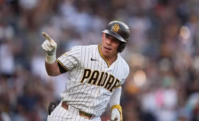 San Diego Padres' Freddy Fermin celebrates after hitting a two-run home run during the fourth inning of a baseball game against the San Francisco Giants Saturday, Aug. 1, 2026, in San Diego. (AP Photo/Gregory Bull)