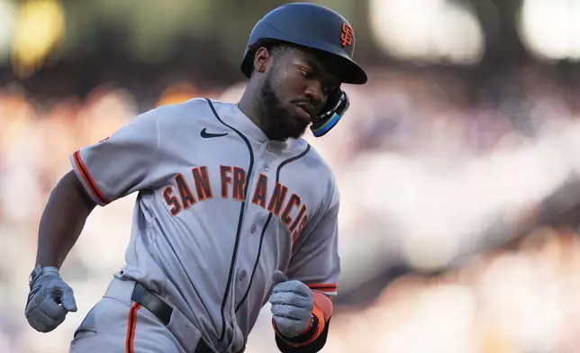 San Francisco Giants' Osleivis Basabe runs the bases after hitting a two-run home run during the third inning of a baseball game against the San Diego Padres Saturday, Aug. 1, 2026, in San Diego. (AP Photo/Gregory Bull)