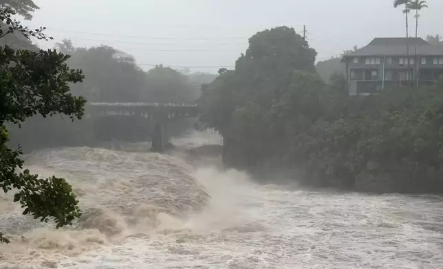 A view of the rising water levels at the Wainaku Street Bridge in Hilo on the Big Island of Hawaii, Saturday, Aug. 15, 2026. (Taylor Cozloff/Civil Beat via AP)