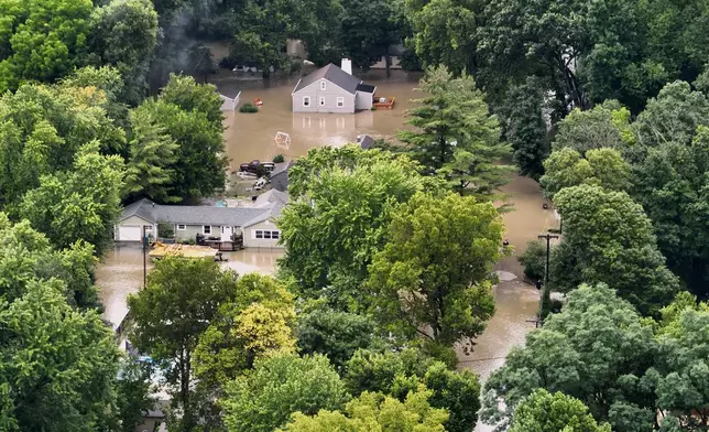 This aerial photo provided by the Indianapolis Fire Department shows flooding in northern Indianapolis, Ind., Saturday, Aug. 15, 2026. (Indianapolis Fire Department via AP)