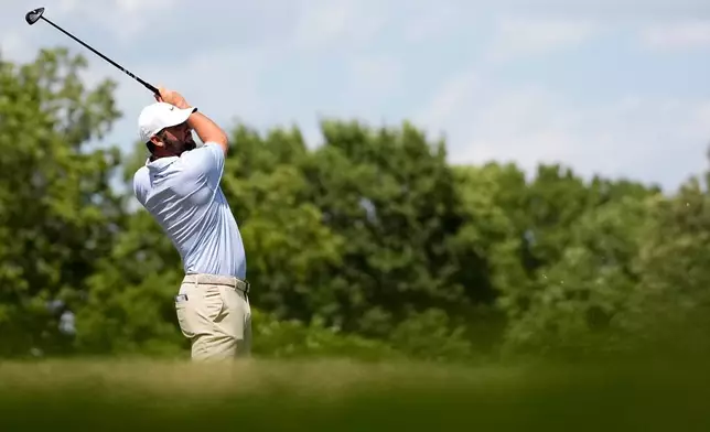 Scottie Scheffler hits from the 12th tee during the final round of the St. Jude Championship golf tournament, Sunday, Aug. 16, 2026, in Memphis, Tenn. (AP Photo/George Walker IV)