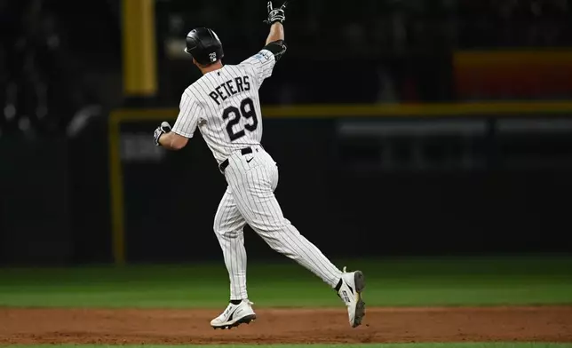 Chicago White Sox's Tristan Peters celebrates after hitting a two-run home during the fifth inning of a baseball game against the Texas Rangers in Chicago, Wednesday, Aug. 26, 2026. (AP Photo/Paul Beaty)