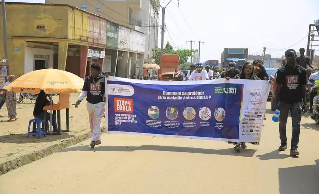 Residents and frontline workers embark on Ebola outbreak awareness campaign in Beni, North Kivu province, eastern Congo, Friday, Aug. 21, 2026. (AP Photo/Sebastien Kitsa Musayi)