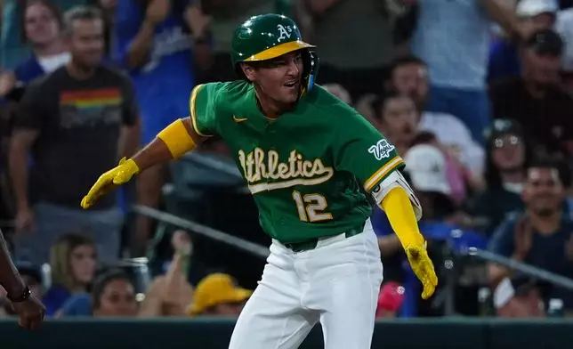 Athletics' Alika Williams (12) reacts after hitting a two-run RBI triple in the sixth inning during a baseball game against the Minnesota Twins Wednesday, Aug. 26, 2026, in West Sacramento, Calif. (AP Photo/Alan Greth)