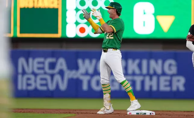 Athletics' Jeff McNeil (22) reacts after hitting an RBI double in the sixth inning during a baseball game against the Minnesota Twins Wednesday, Aug. 26, 2026, in West Sacramento, Calif. (AP Photo/Alan Greth)
