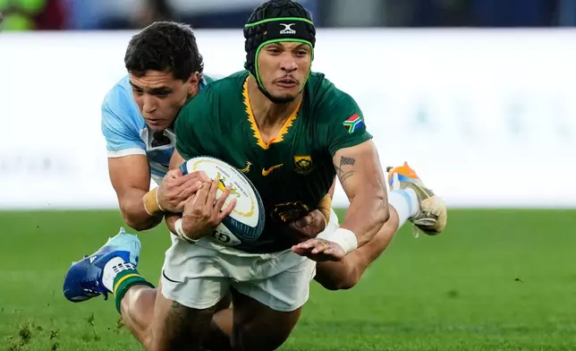 South Africa Edwill van der Merwe is tackled by Argentina's Agustin Moyano during a rugby test match in Buenos Aires, Argentina, Saturday, Aug. 8, 2026. (AP Photo/Gustavo Garello)
