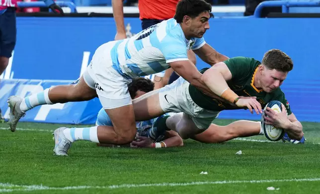 South Africa Ethan Hooker is tackled by Argentina's Santiago Carreras during a rugby test match in Buenos Aires, Argentina, Saturday, Aug. 8, 2026. (AP Photo/Gustavo Garello)