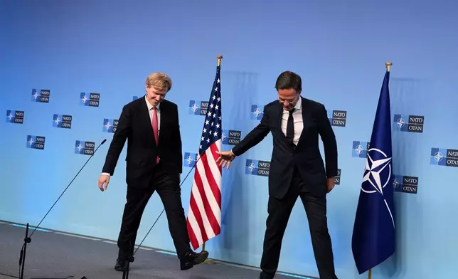 NATO Secretary General Mark Rutte, right, and United States Undersecretary of Defense Elbridge Colby leave the podium after addressing the media at NATO headquarters in Brussels, Thursday, Aug. 27, 2026. (AP Photo/Virginia Mayo)