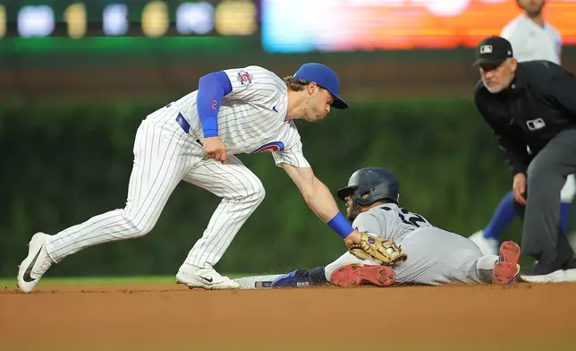 New York Yankees' José Caballero steals second base beating the tag by Chicago Cubs' Nico Hoerner during the fifth inning of a baseball game, Saturday, Aug. 1, 2026, in Chicago. (AP Photo/Melissa Tamez)