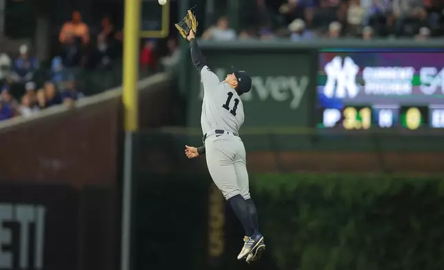 New York Yankees' Anthony Volpe jumps and misses a ball hit by Chicago Cubs' Alex Bregman during the fourth inning of a baseball game, Saturday, Aug. 1, 2026, in Chicago. (AP Photo/Melissa Tamez)