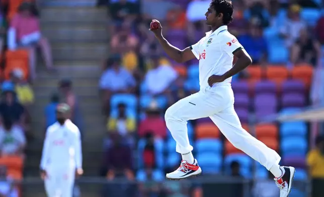 Bangladesh's Hasan Mahmud bowls to Australia during their cricket test match in Darwin, Australia, Thursday, Aug. 13, 2026. (James Ross/AAP Image via AP)