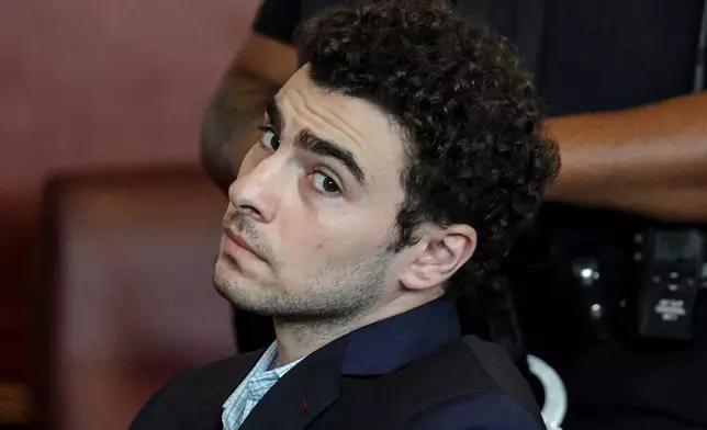 FILE - Luigi Mangione appears at a hearing in Manhattan Criminal Court in New York, Monday, May 18, 2026. (Jeenah Moon/Pool Photo via AP, File)