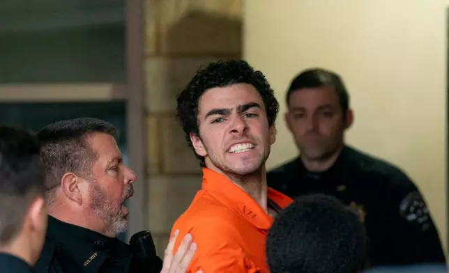 FILE - Suspect Luigi Mangione is taken into the Blair County Courthouse on Tuesday, Dec. 10, 2024, in Hollidaysburg, Pa. (Benjamin B. Braun/Pittsburgh Post-Gazette via AP, File)