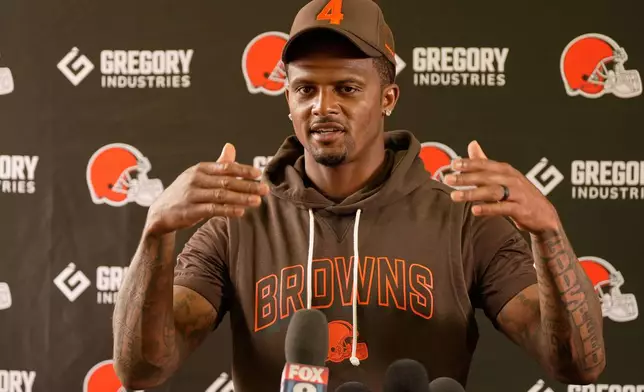 Cleveland Browns quarterback Deshaun Watson (4) talks with the media during an NFL football training camp, Saturday, Aug. 1, 2026, in Berea, Ohio. (AP Photo/Sue Ogrocki)