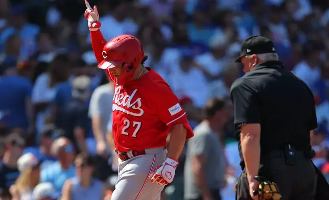 Cincinnati Reds' Sal Stewart celebrates after hitting a home run during the fifth inning of a baseball game against the Chicago Cubs, Friday, Aug. 28, 2026, in Chicago. (AP Photo/Melissa Tamez)